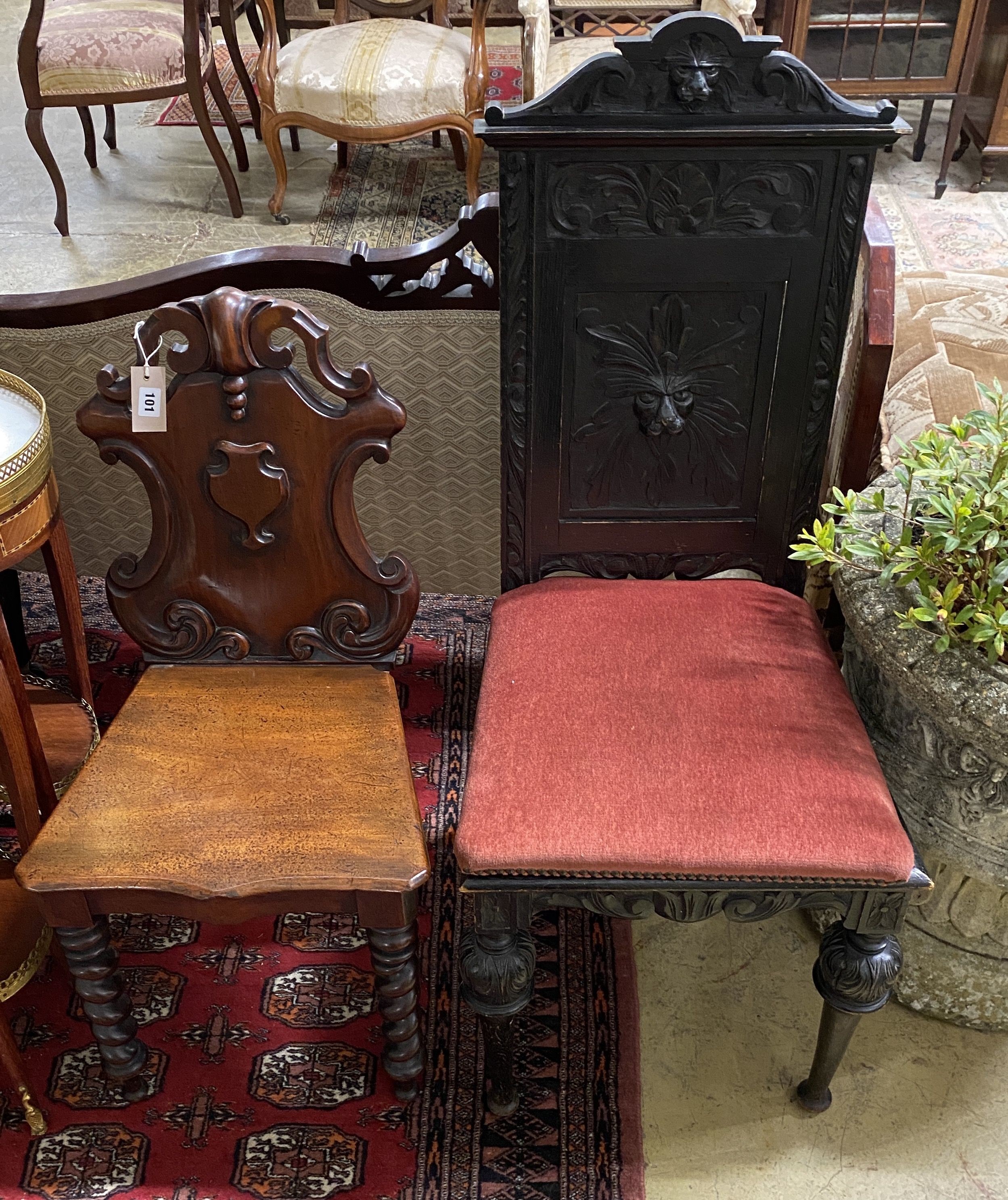 A Victorian mahogany hall chair and a Flemish carved oak dining chair